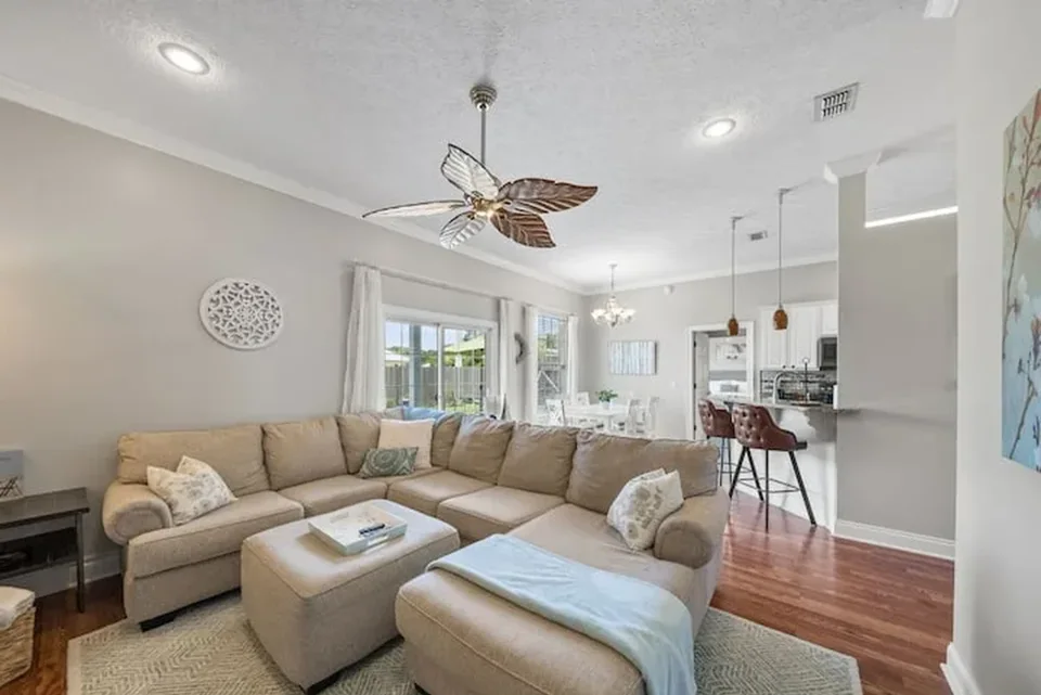 Bright living room opening into the kitchen