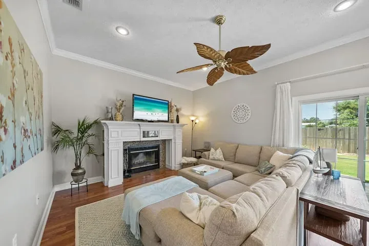 Living room with a fireplace and television